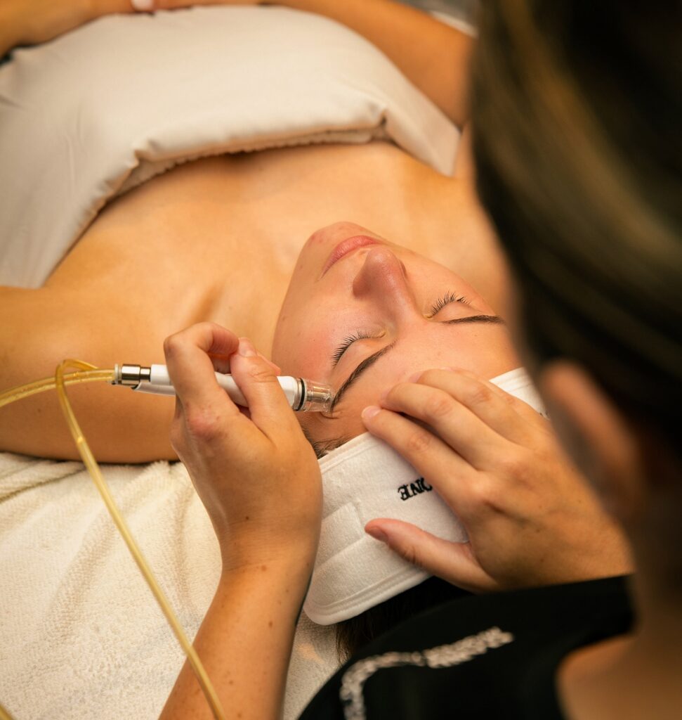 Woman receiving a microdermabrasion treatment