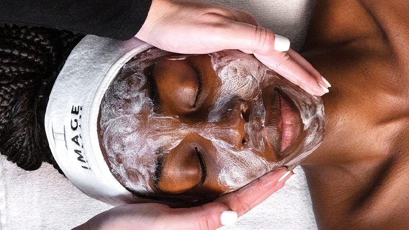 Woman receiving a facial